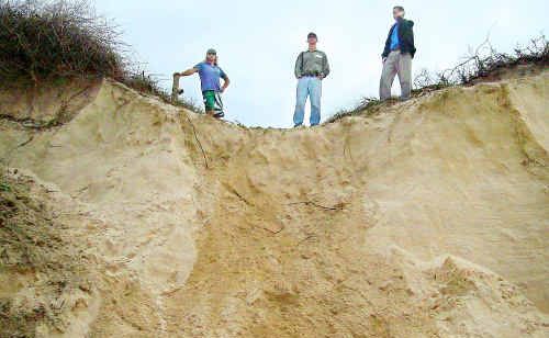 SES volunteer driver Farron Young, Clarence Valley Council environmental planning co-ordinator Scott Lenton and council manager of strategic planning Dave Morrison take a look at sand dune at One Tree, Wooli during the 2009 floods. A draft management plan for Wooli village suggests residents should retreat from the area rather than try to stablise it. SES volunteer driver Farron Young, Clarence Valley Council environmental planning co-ordinator Scott Lenton and council manager of strategic planning Dave Morrison take a look at sand dune at One Tree, Wooli during the 2009 floods. A draft management plan for Wooli village suggests residents should retreat from the area rather than try to stablise it.